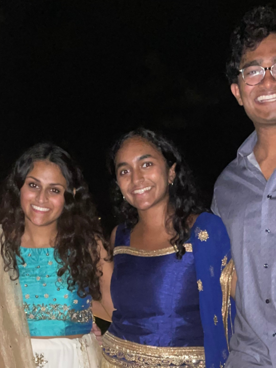 Kiran A. poses with friends at a campus event