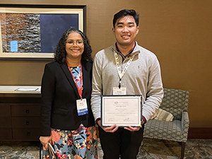 RCPRS student poses with faculty.