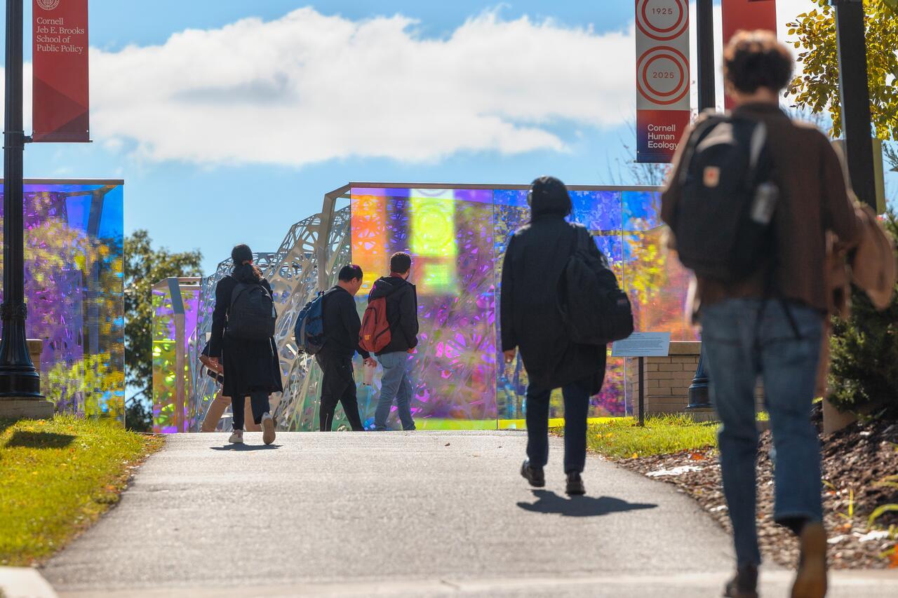 Students pass by the polyform sculpture near MVR.