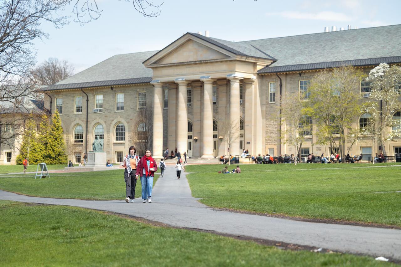 Students walk to class through the Arts Quad.