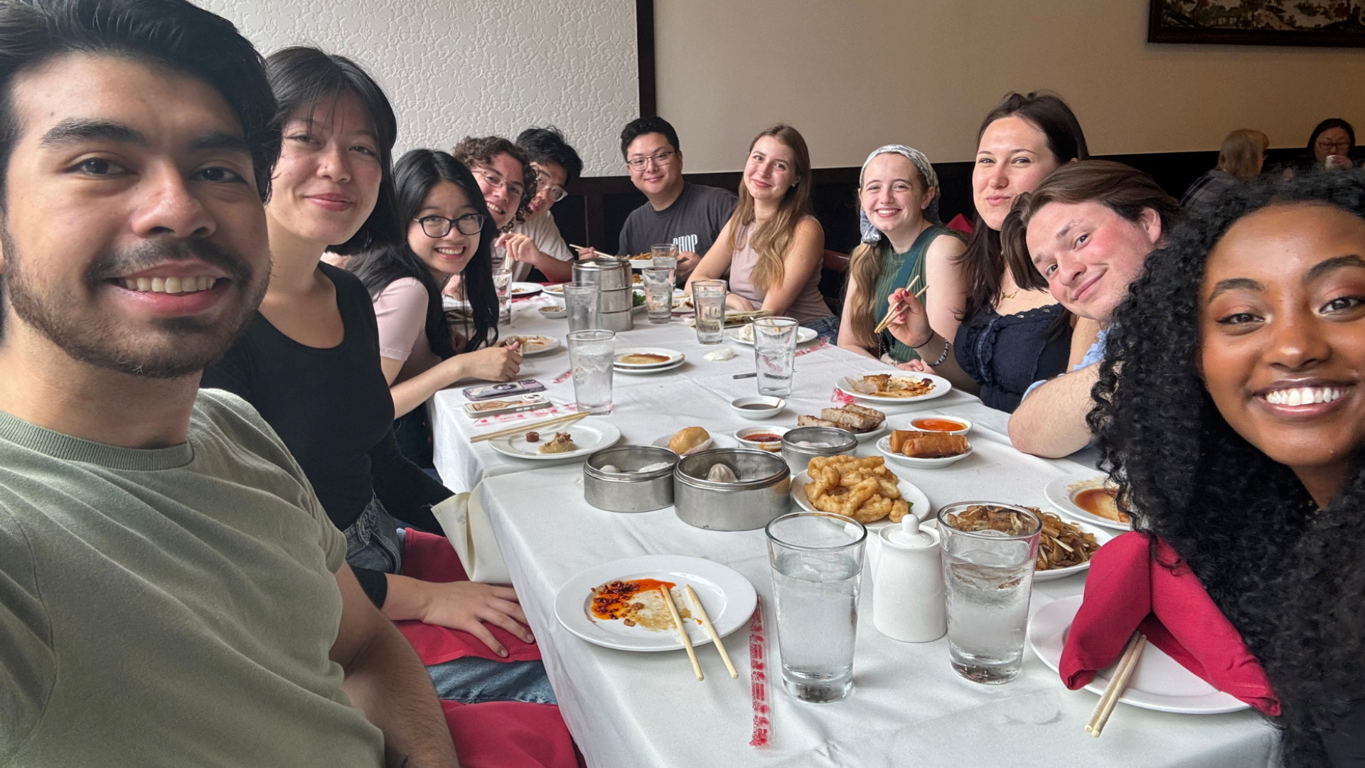 A group of students enjoy a meal together.