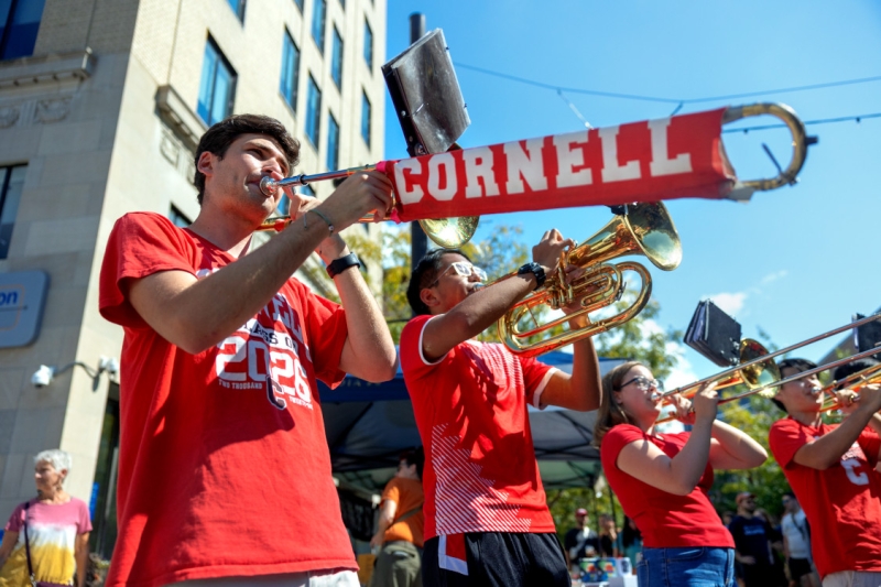 The Big Red Band performs in formation at Welcome Students Weekend, an event bringing students from Cornell, Ithaca College and Tompkins Cortland Community College (TC3) together.