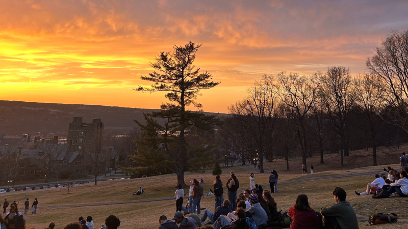Groups of students enjoy sunset on Libe Slope.