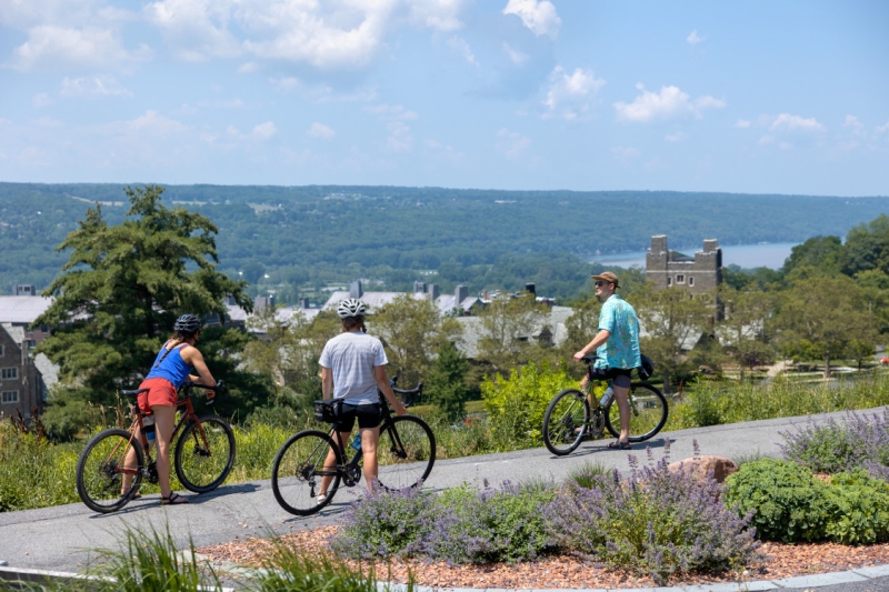 Bikers enjoy the vista from Libe Slope on a warm summer day.