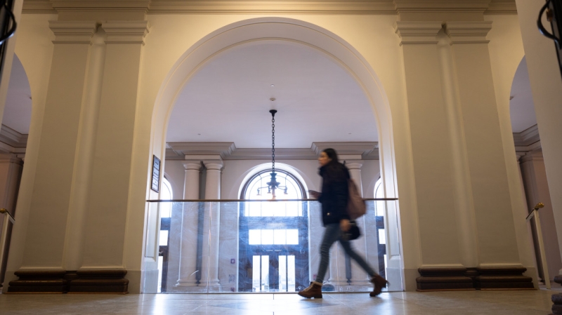 Students pass through the halls of Goldwin Smith Hall during class change.