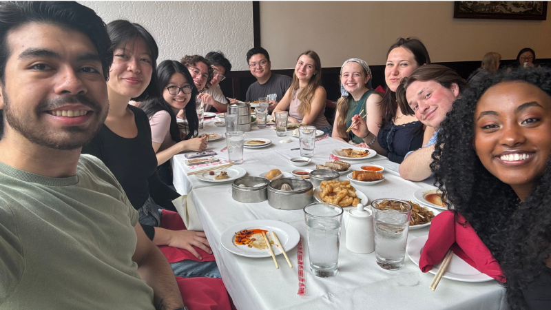 Oswaldo and friends enjoy dinner while studying abroad.