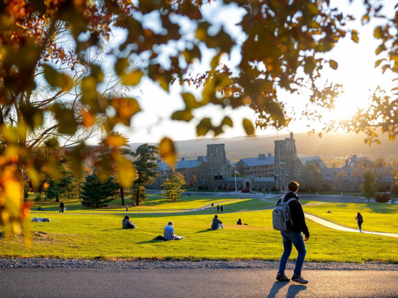 Students enjoy an autumn sunset from Libe Slope.