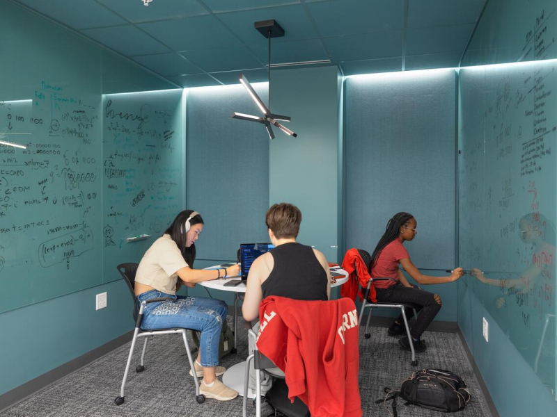 The new Martin Y. and Margaret Lee Tang Hall: Students work on a project together in a study space.