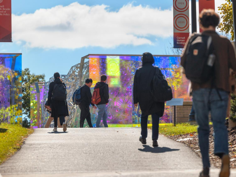 Students pass by the polyform sculpture near MVR.