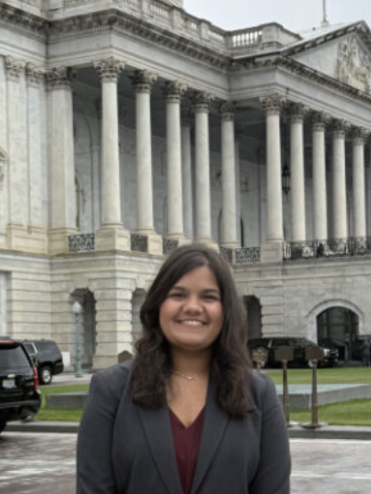 Gargi poses in front of U.S. government buildings.