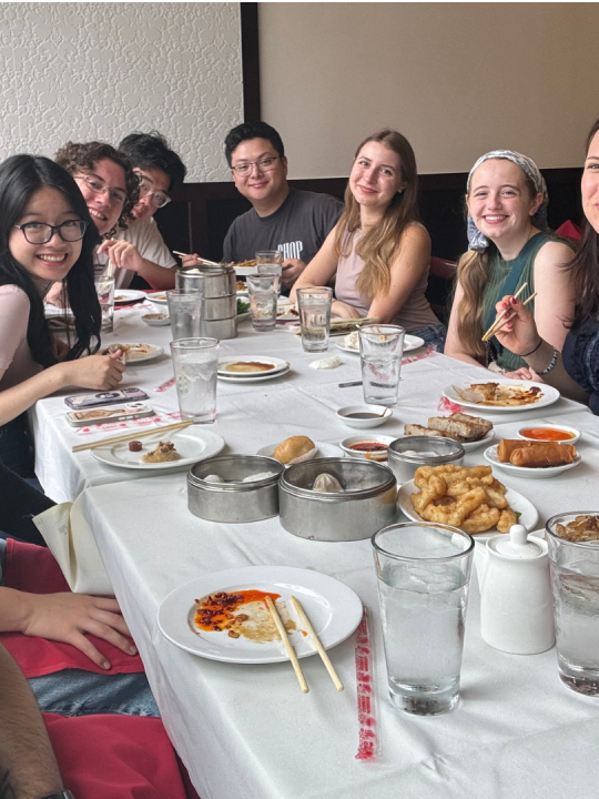 Oswaldo and friends enjoy dinner while studying abroad.