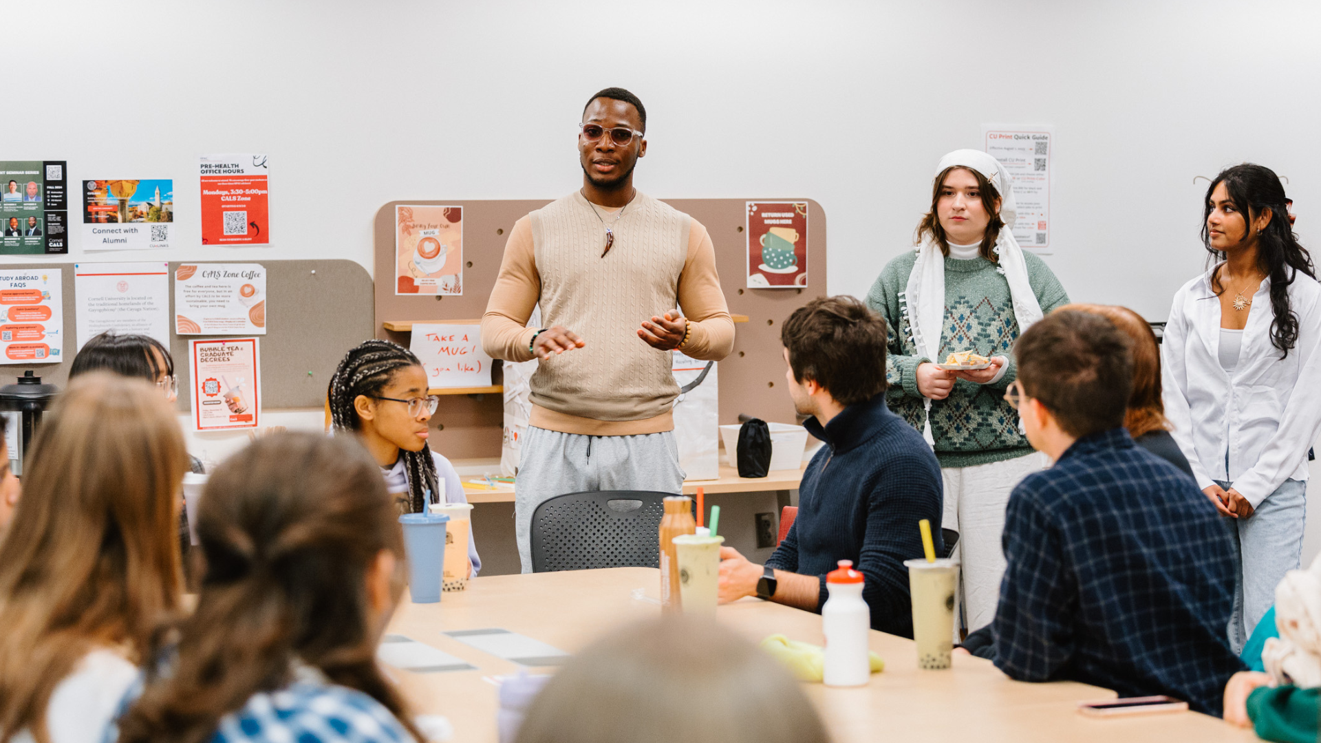 Kingsley presents to a group of students.